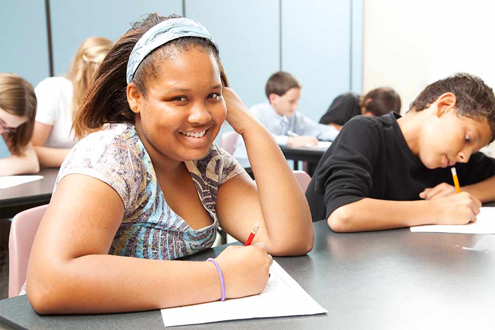 Engaged, smiling student among her peers